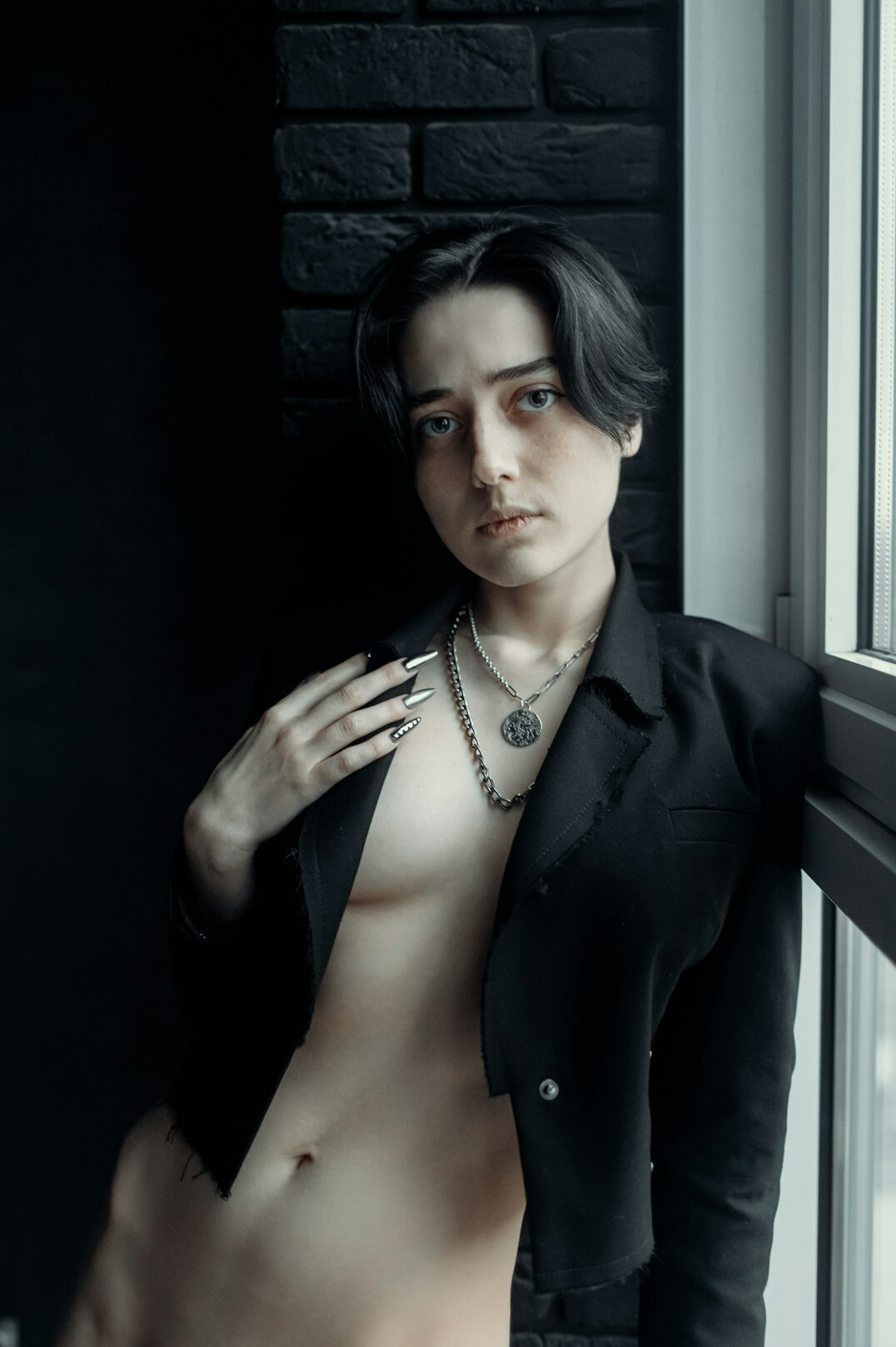 Portrait of a young Uruguayan man with short dark hair in a denim jacket