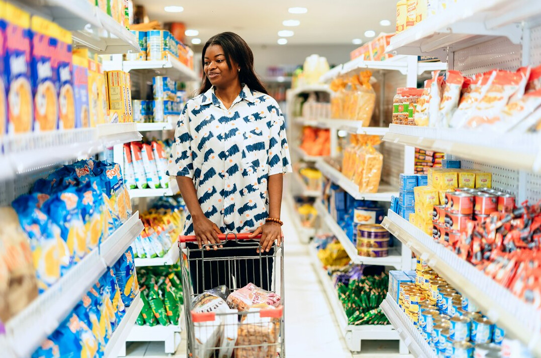 group of shoppers in supermarket